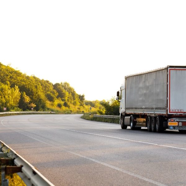 arriving-truck-road-rural-landscape-sunset-min
